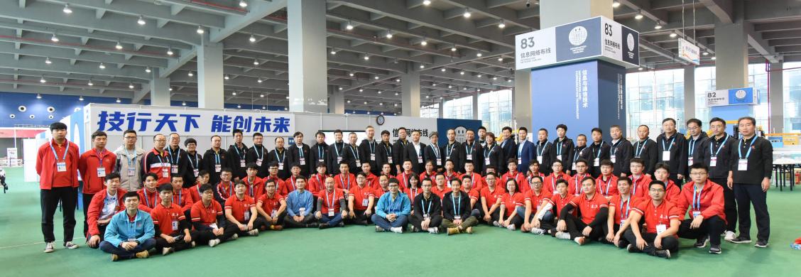 <Group photo of the participants and others involved in the “Information Network Cabling Skills” competition>