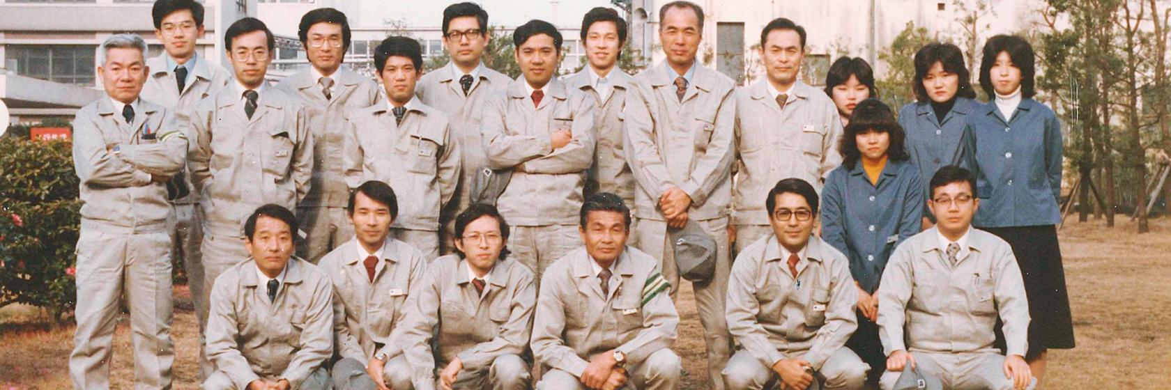 Group photo with colleagues at the Osaka Works. Okazaki is the third from the right in the front row. Kimura has his arms folded in the middle of the back row.