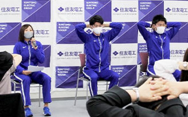 Doing stretches in synch with Miyake's instructions