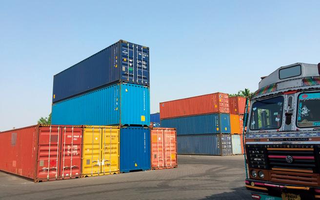 An inland container depot (ICD) that collects internationally traded goods. After clearing customs, the goods are loaded into containers and transported by trucks and freight trains (near Delhi).
