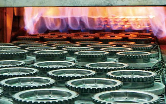 Green compacts are heated in a high-temparature furnce