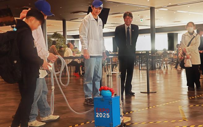 A child operates the robot