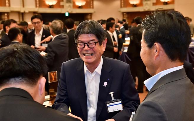 Speaking with partners at the social gathering