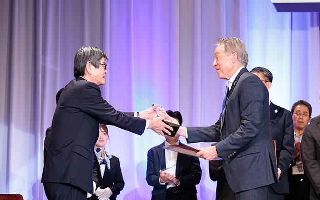 Presenting a trophy and certificate